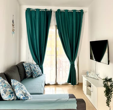 a living room with a couch and a television