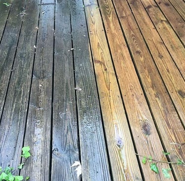 A wooden deck cleaned 50/50 to show the difference