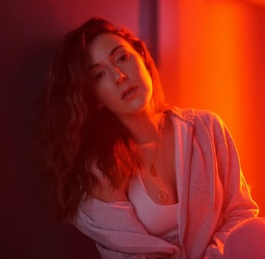 a woman sitting on a bench in a room