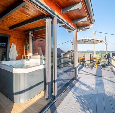 a hot tub tub in a deck with a view of the mountains