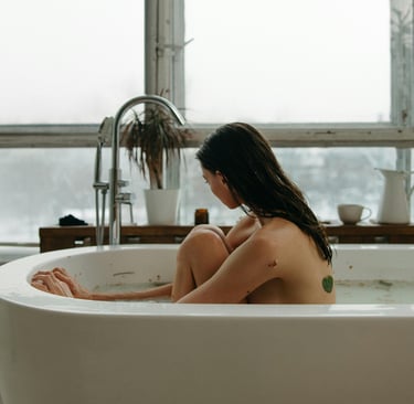 a woman sitting in a bathtub