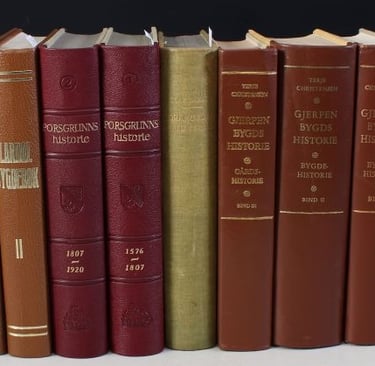The spines of eight bygdeboker