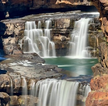 scenic view of a waterfall with three tiers