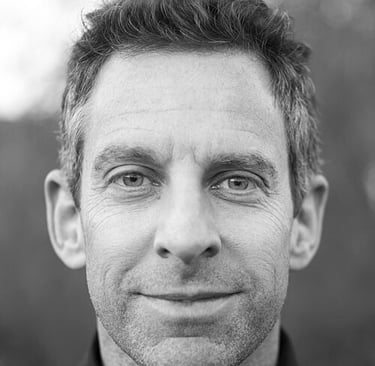 Sam Harris with a tie on a black and white photo
