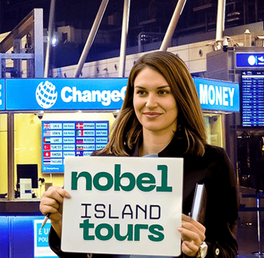 Professional driver holding name board at Colombo Airport pickup for guests