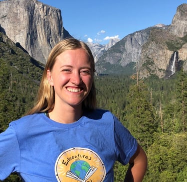 a teacher standing on a rock in front of Tunnel View in Yosemite National Park California