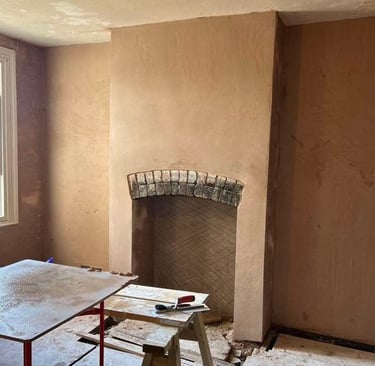 Smooth plasterwork on a residential wall by Franklins Plastering.