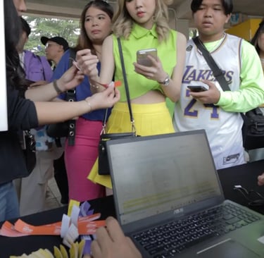 Group of attendees participating in digital scavenger hunt activation using smartphones at event