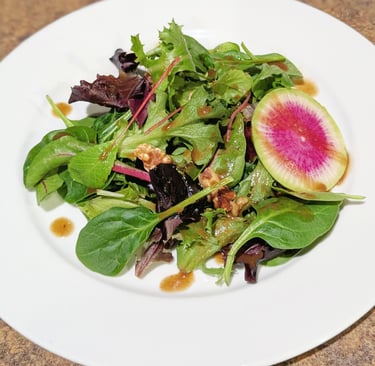 baby greens salad with watermelon radish & balsalmic dressing. Portland gluten free dairy-free vegan
