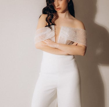 a woman in a white top and pants