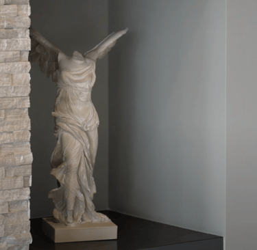 a statue of a woman holding a sword