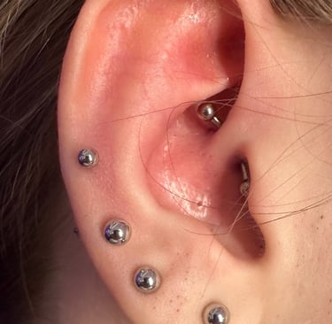 Expert rook piercing by Jooles in Stonehaven