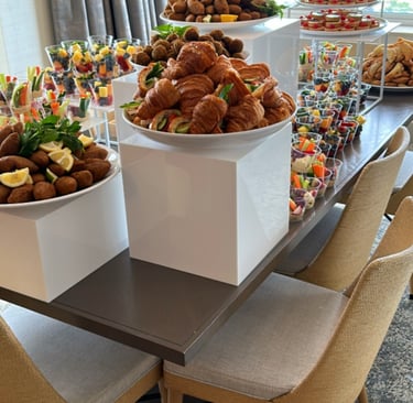 a table with a variety of food and snacks styled 
