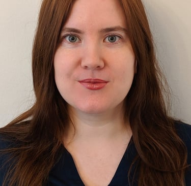 Adept Mediation professional female mediator smiling and looking directly at a client