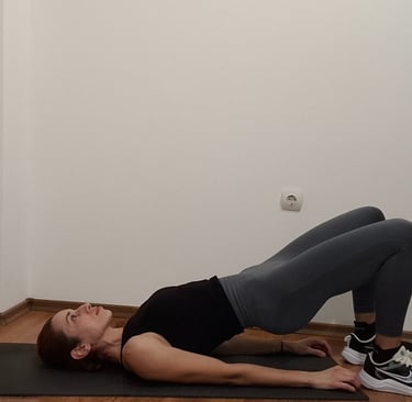 a woman is doing a yoga pose on a mat