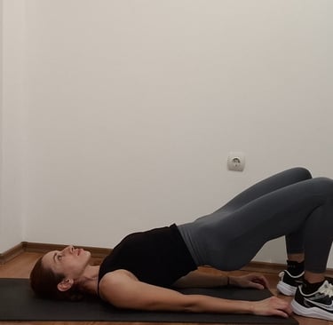 a woman is doing a yoga pose on a mat