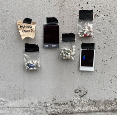 fun.arc.ik. necklaces in zip-lock bags on a concrete wall product picture