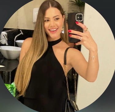 a woman in a black dress is taking a selfie