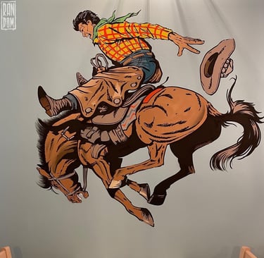 mural de un baquero a caballo en una pared de un restaurante