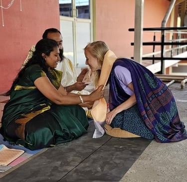 a woman in a green dress sitting on a bench