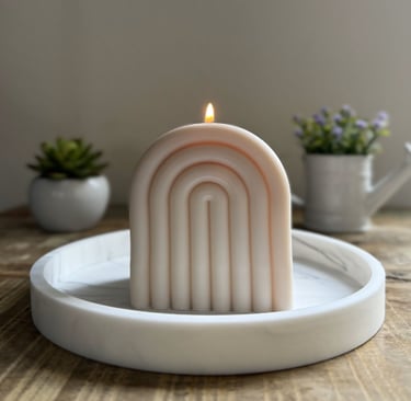 Arch candle lit over a plate