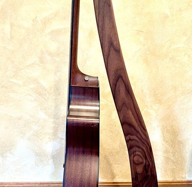 Custom, handcrafted guitar stand made from walnut, maple and purple heart
