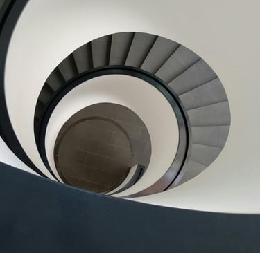 Architectural spiral staircase representing Systeme.io automation