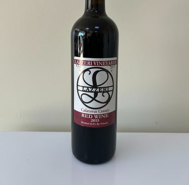 An unopened bottle of wine labeled 2015 Red Blend