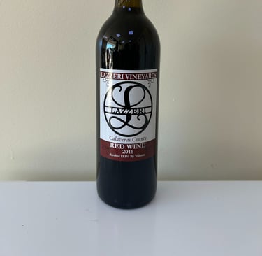 An unopened bottle of wine labeled 2016 Red Blend