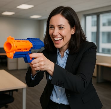 a woman in a suit and tie is holding a nerfet gun