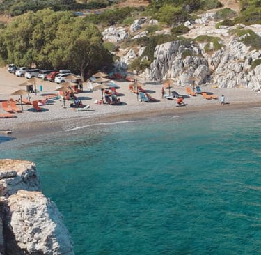 a beach with many chairs and umbrellas