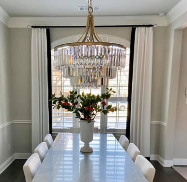 Custom French Pleated Drapery with Blalck accent band on leading edge.  Custom Black Hardware with acrylic finials Kasmir Fab