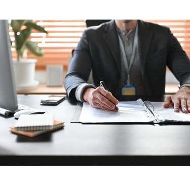 image of accountant office with accountant at desk