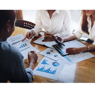 accountant with business owners with business forms