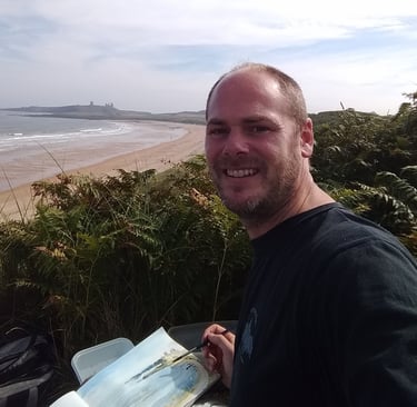 Mark Exon sketching Dunstanburgh Castle