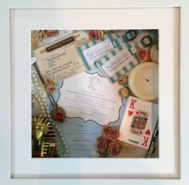 a Memory Box frame featuring wedding keepsakes and flowers