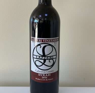 A close up picture of a wine bottle labeled Syrah