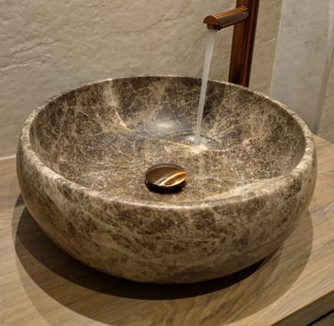 a stone sink with a faucet and a faucet faucet