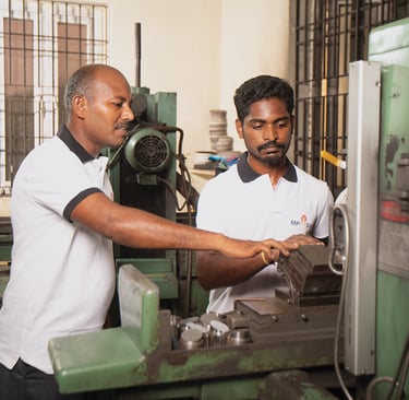 MP Asia Engineering staff working on CNC machine