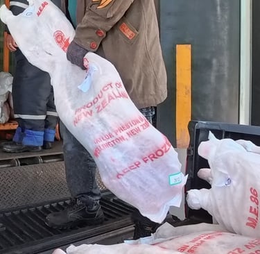 a man in a brown jacket is holding a bag of plastic bags