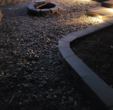 concrete patio with a gravel fire pit