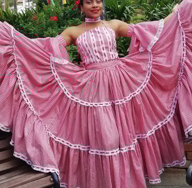 A dancer of Cumbia with a traditional dance costumbe