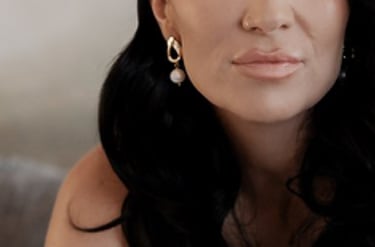 a bride putting her shoes on