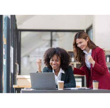 two women looking at laptop screen