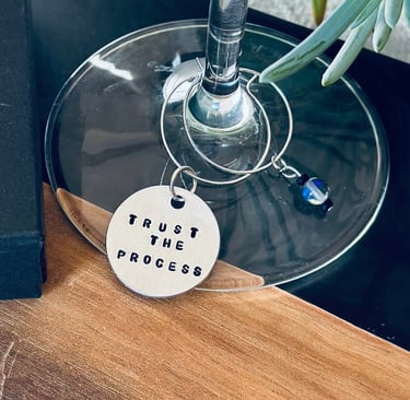 stamped trust the process wine charm