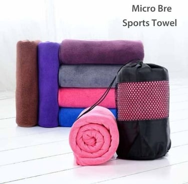 a micro bre hand towel with black bag on white floor