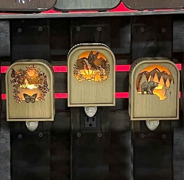 three decorative wooden carved nightlights