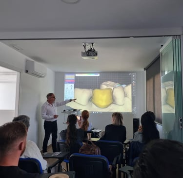 a group of people in a room with a projector