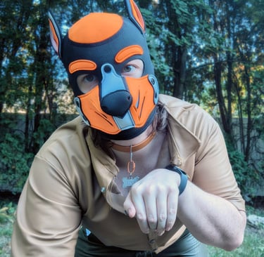 A man in a pup mask outdoors.