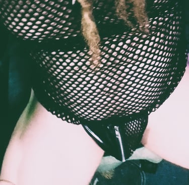 a man dressed in a mesh top in a g-string